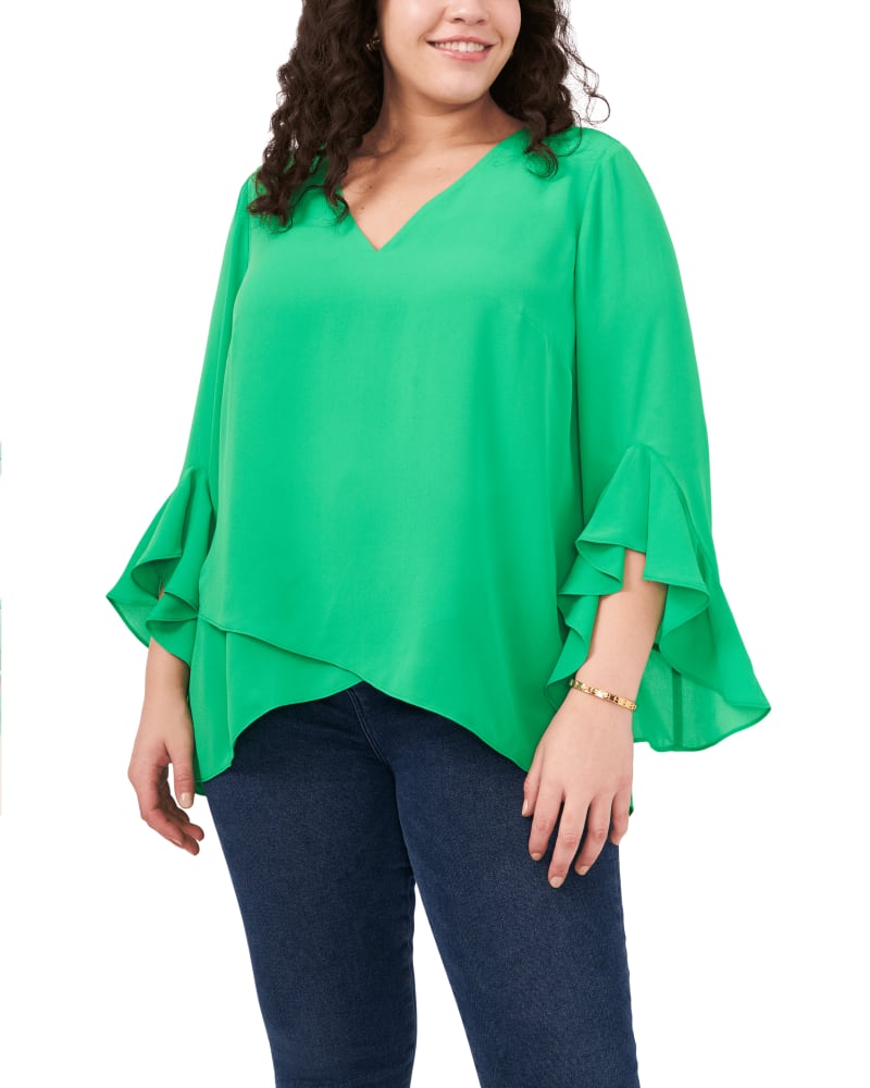 Front of a model wearing a size 1X Natalie Flutter Sleeve Tunic in VIVID GREEN by Vince Camuto. | dia_product_style_image_id:260979